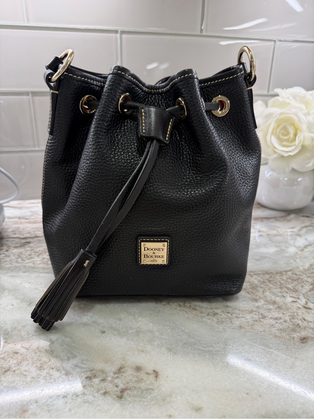 Dooney & Bourke Black Pebbled Leather Drawstring Bucket Bag with Tassel